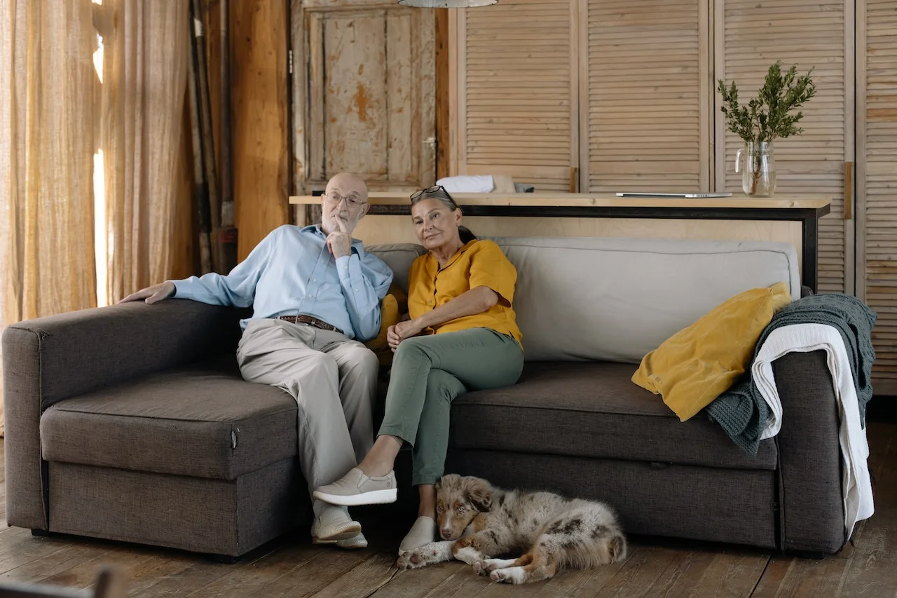 Older couple sitting on the couch