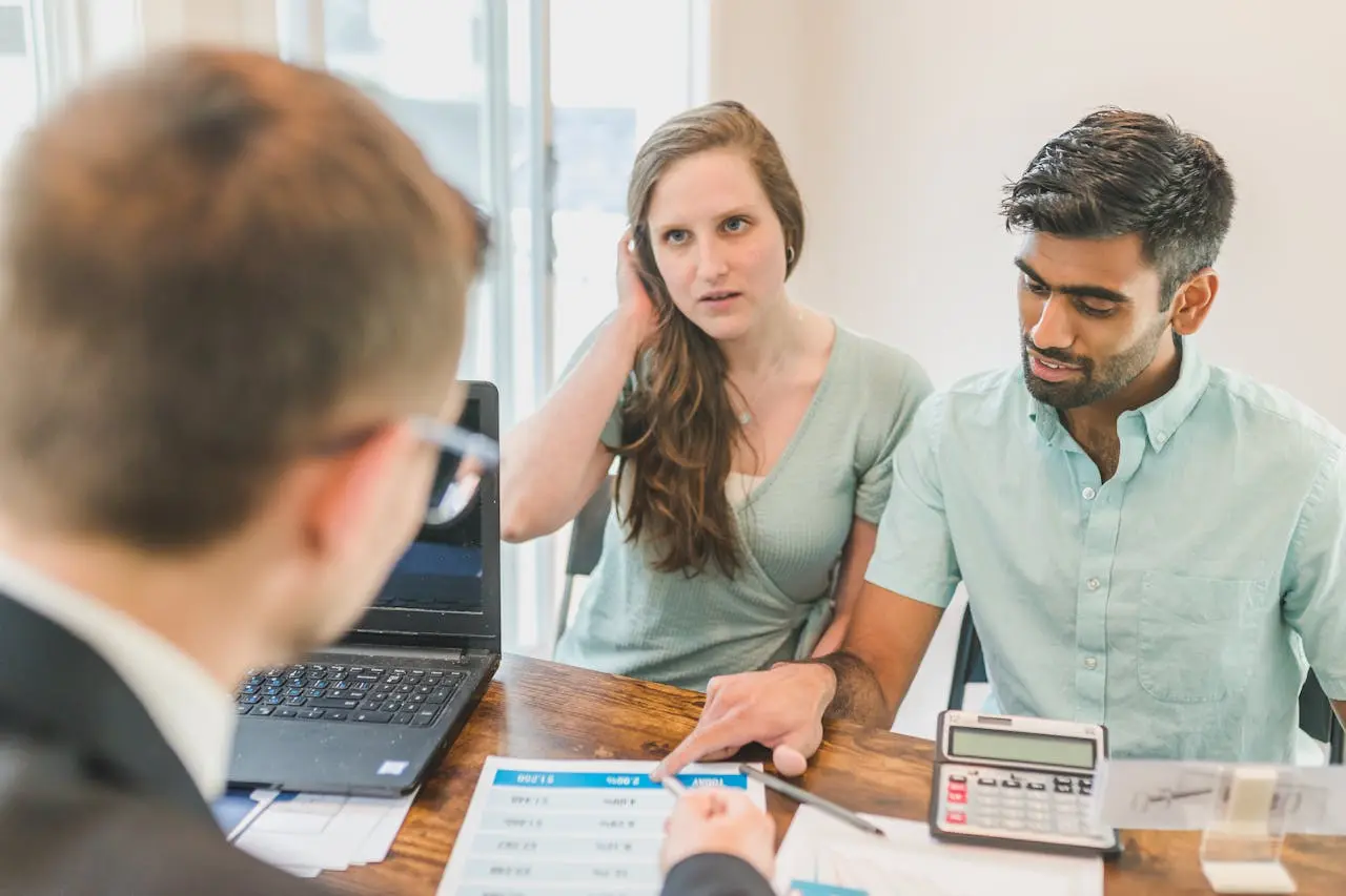 Couple sitting with an advisor